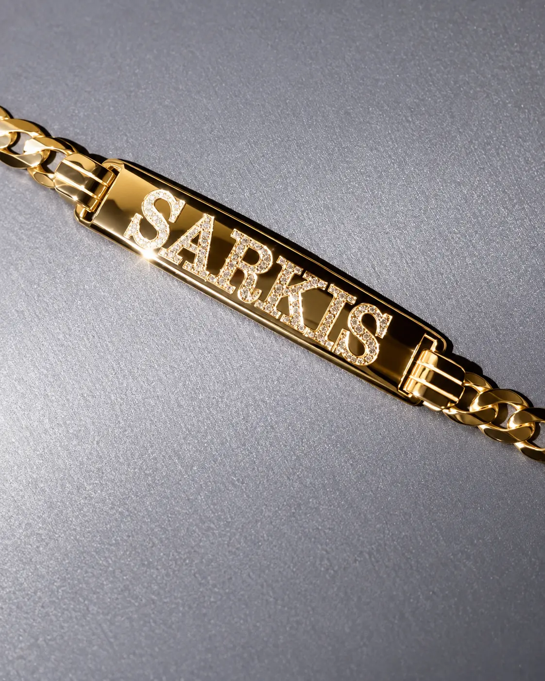 Finished personalized gold bracelet with diamond-set lettering
