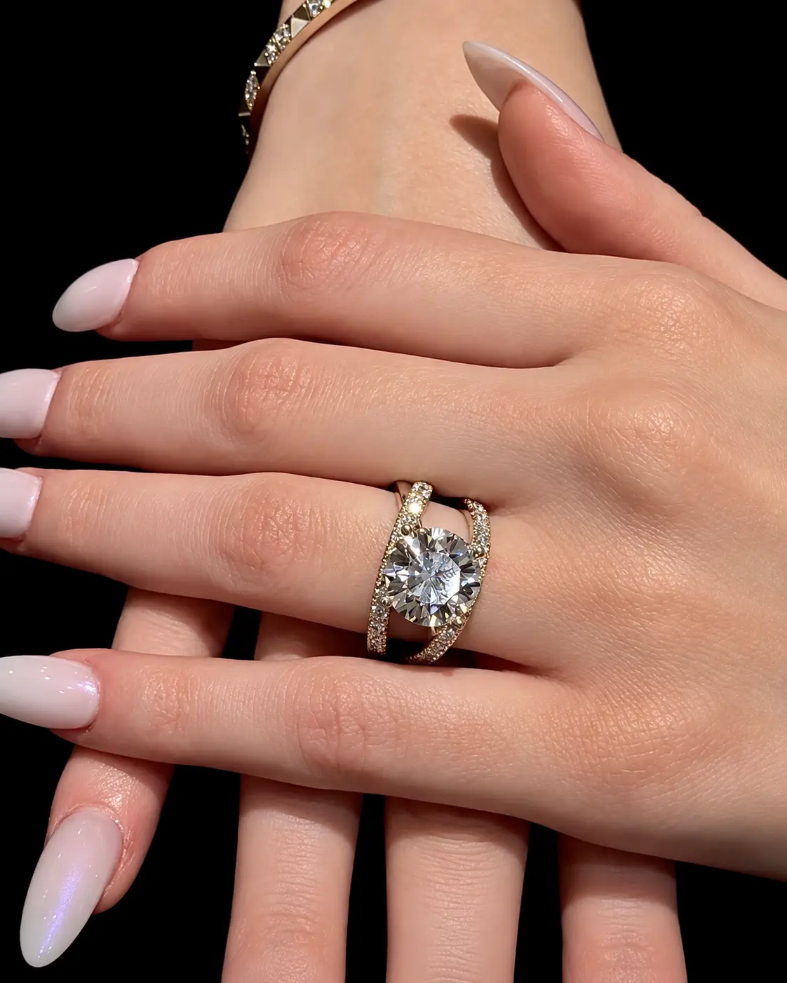 Split-shank diamond engagement ring worn on a hand
