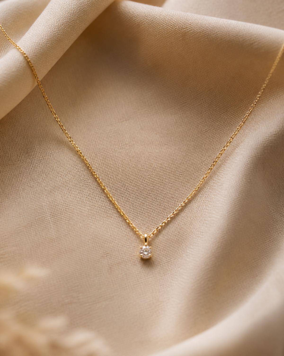 Fine gold chain necklace with a small diamond drop